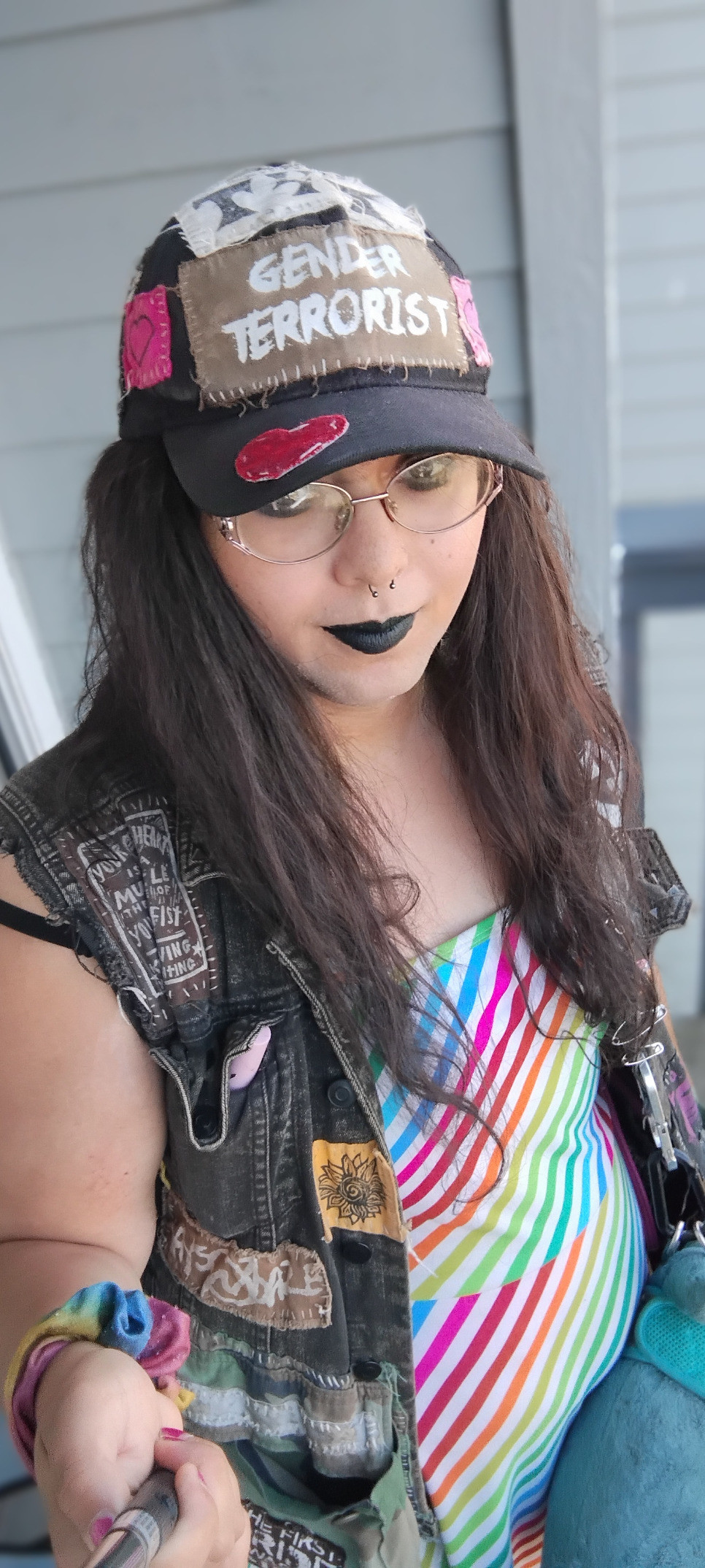 selfie of me in the gender terrorist hat with rainbow dress and blahaj